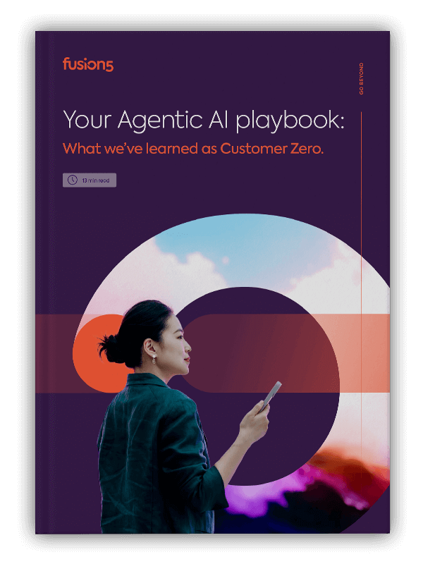 a woman holding her phone looks to the right